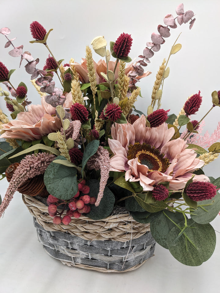 Herbstgesteck Sonnenblumen Heide rosa