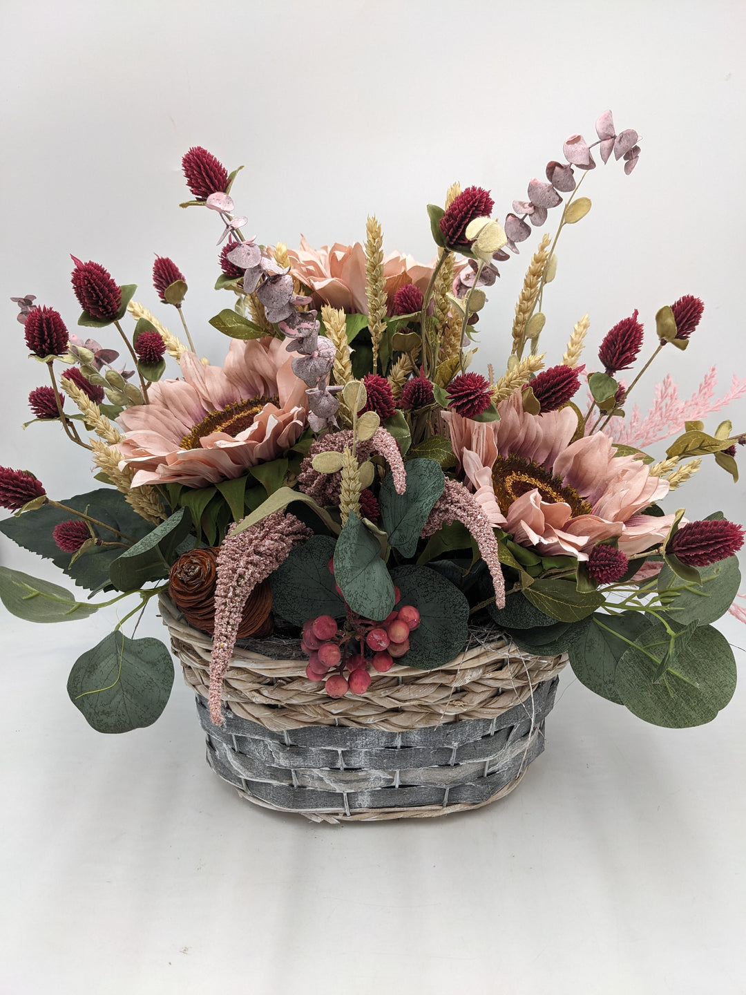 Herbstgesteck Sonnenblumen Heide rosa