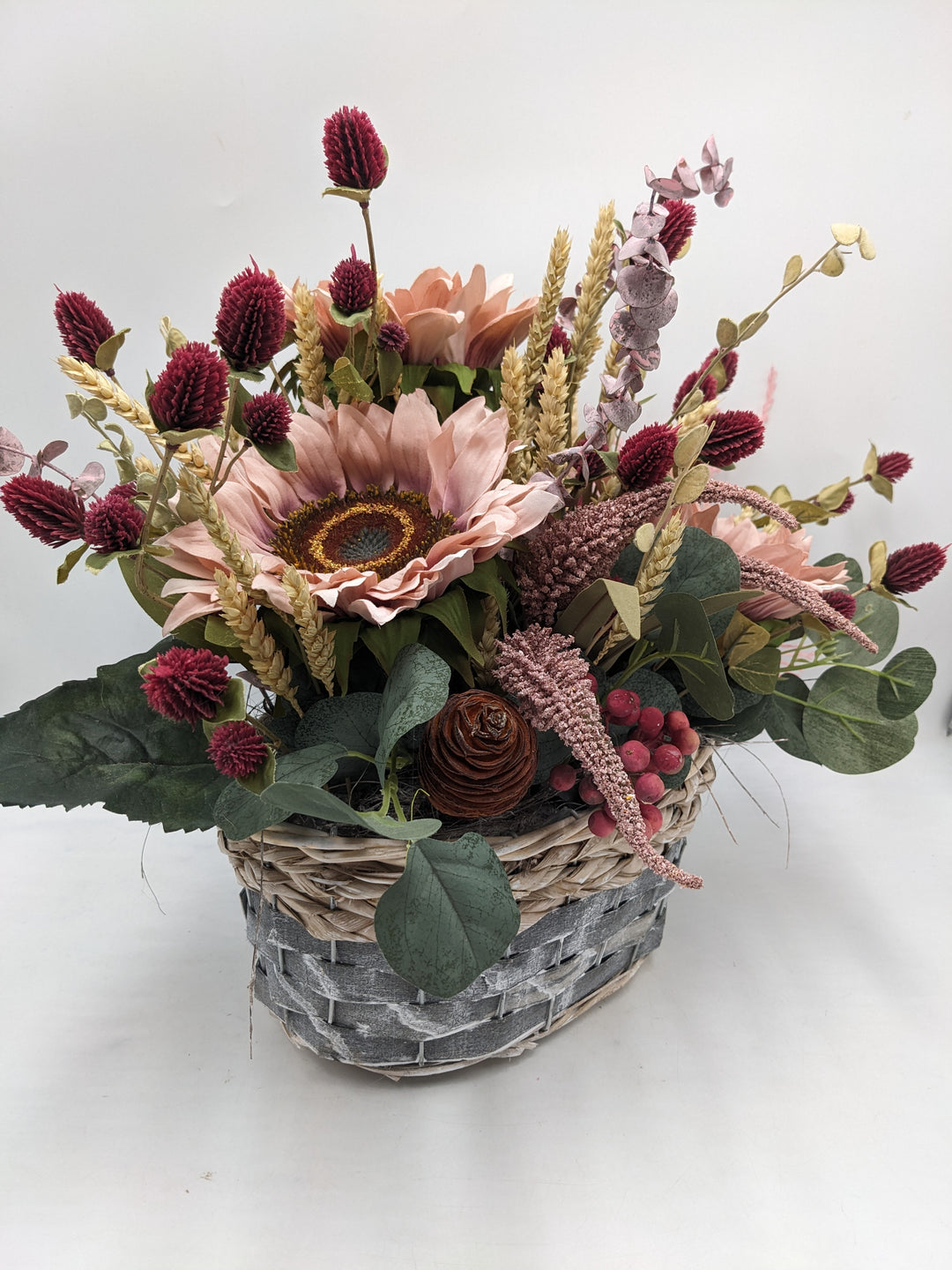 Herbstgesteck Sonnenblumen Heide rosa
