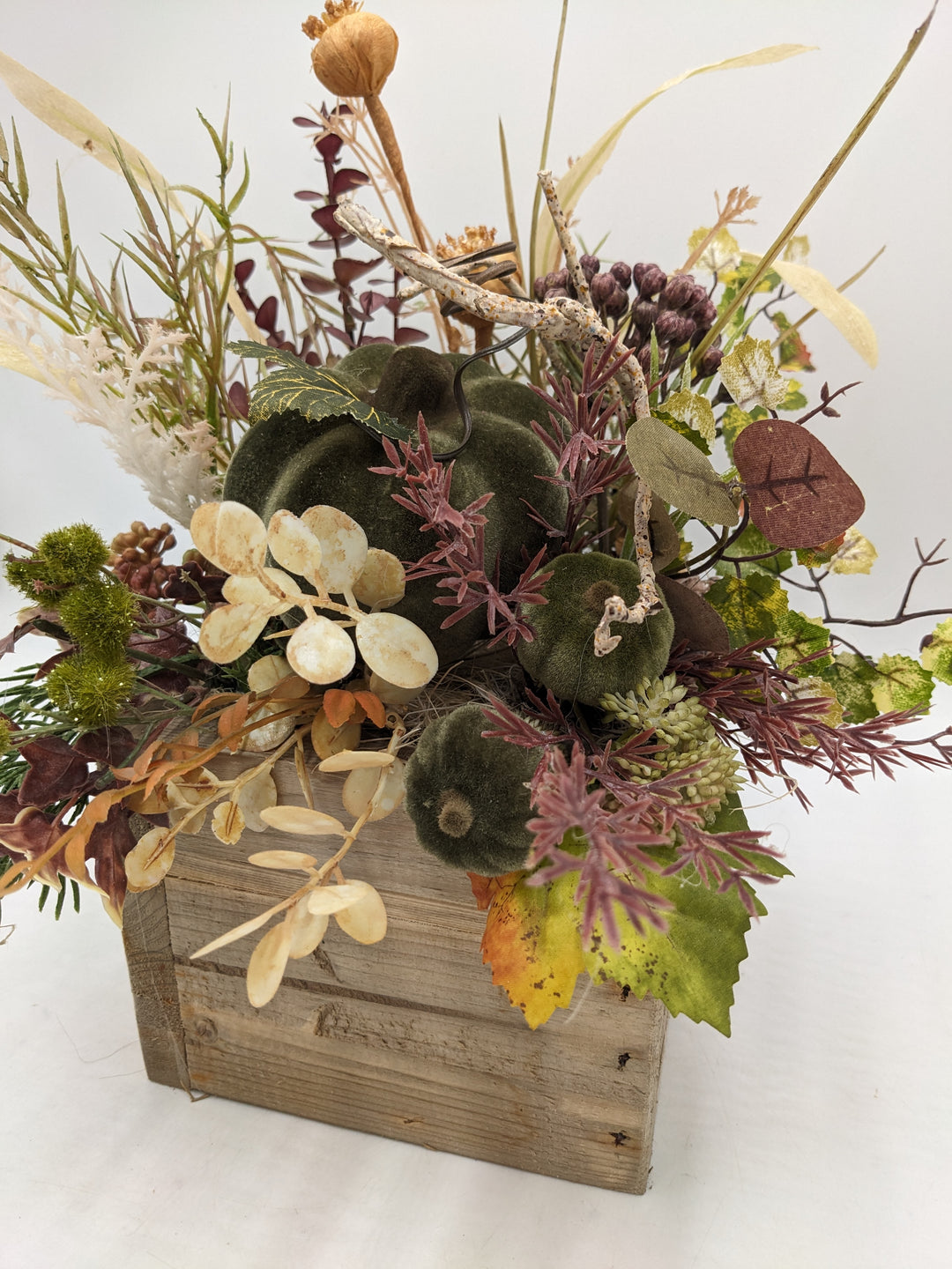 Herbstgesteck Kürbis Gräser grün