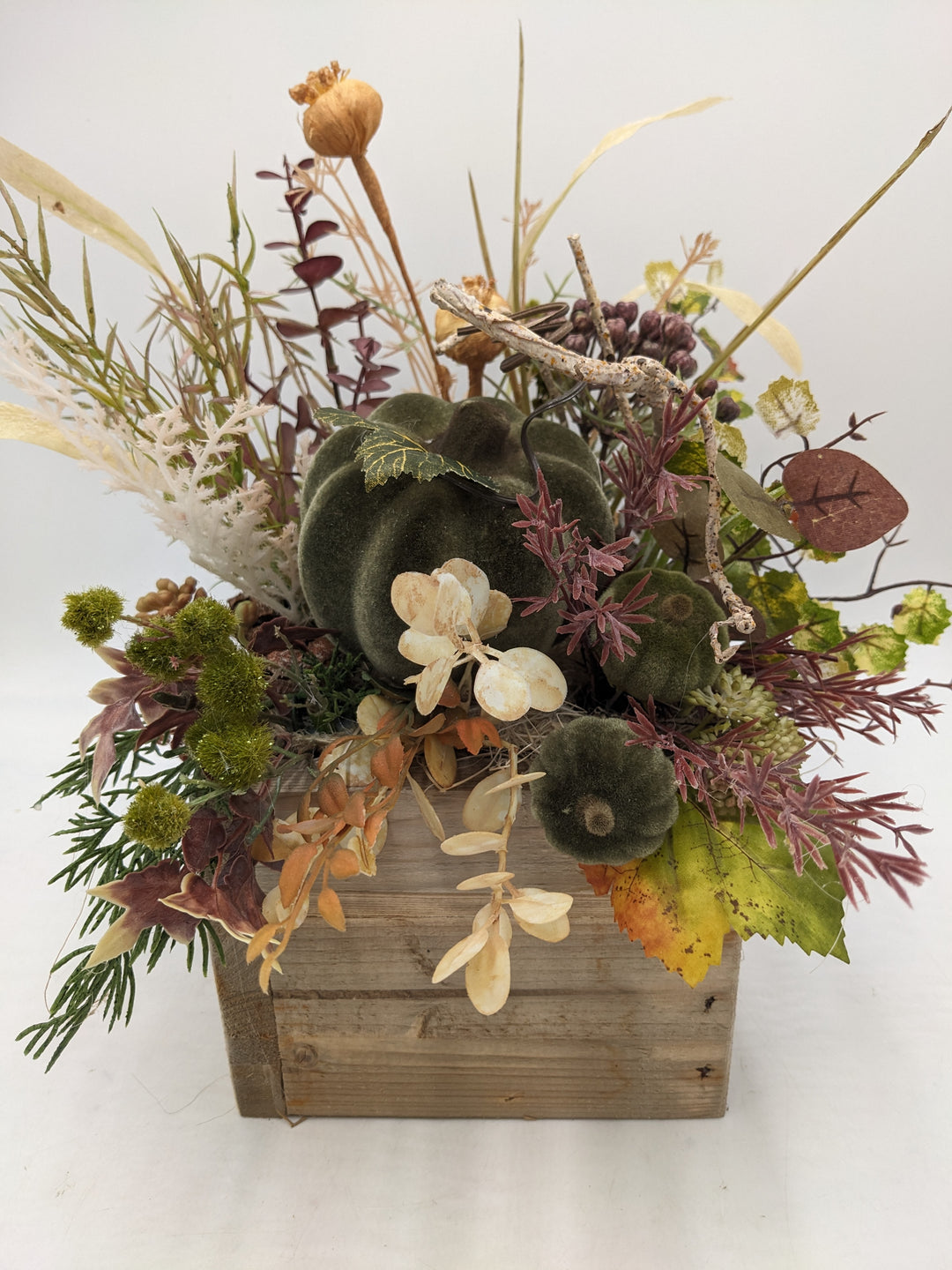 Herbstgesteck Kürbis Gräser grün