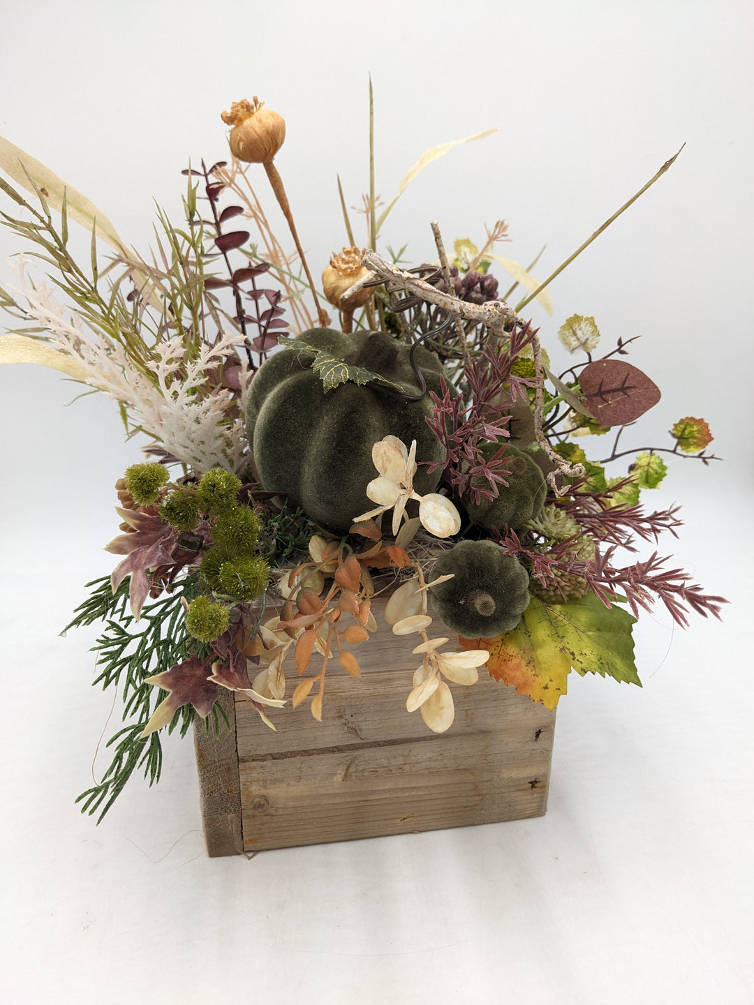 Herbstgesteck Kürbis Gräser grün