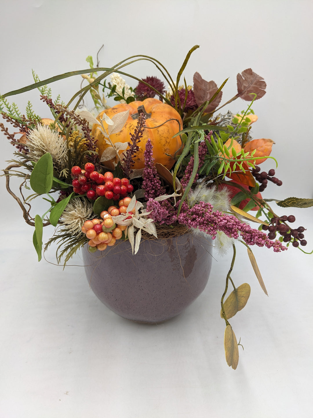 Herbstgesteck Kürbis Heide Laub orange