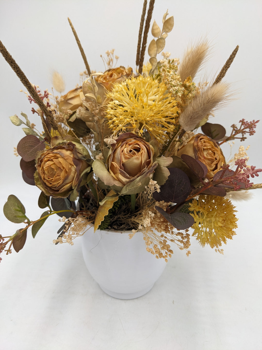 Herbstgesteck Rosen Gräser Curry gelb