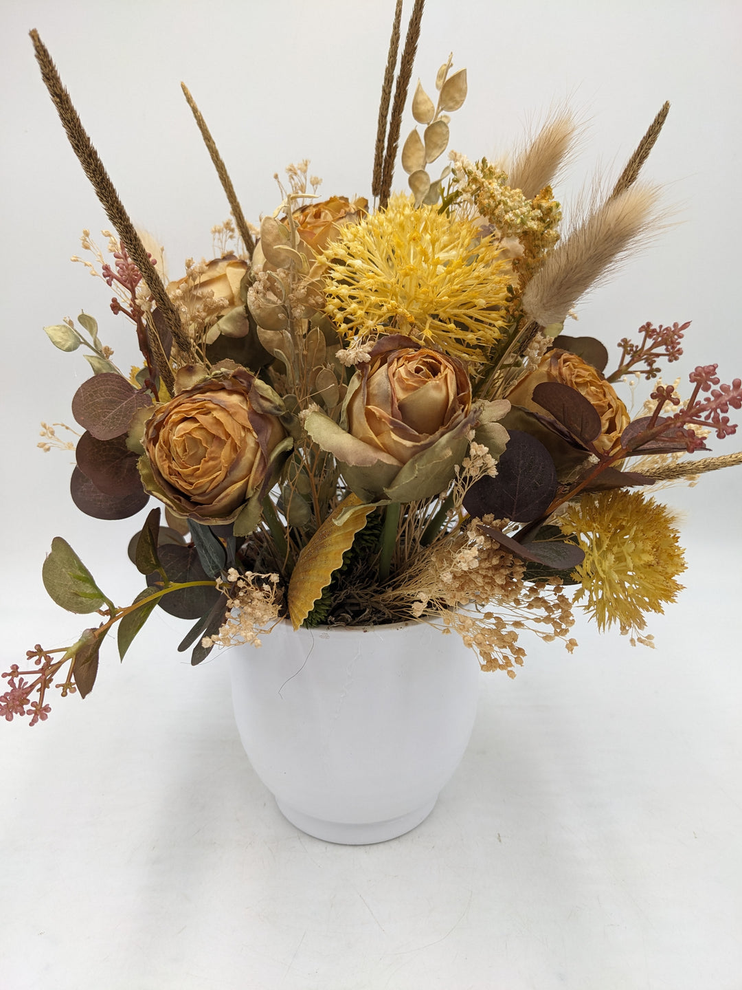 Herbstgesteck Rosen Gräser Curry gelb