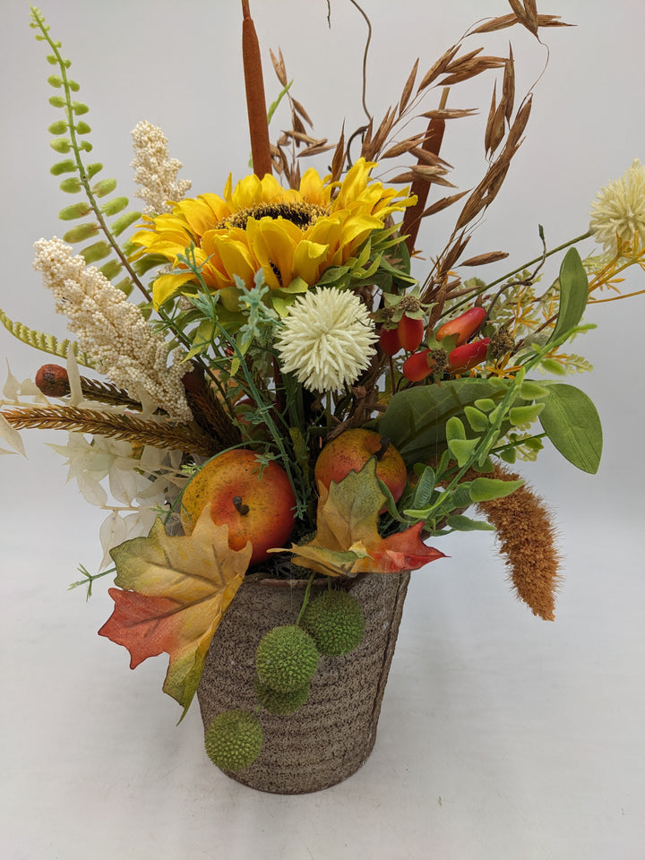 Herbstgesteck Sonnenblume Äpfel Gräser