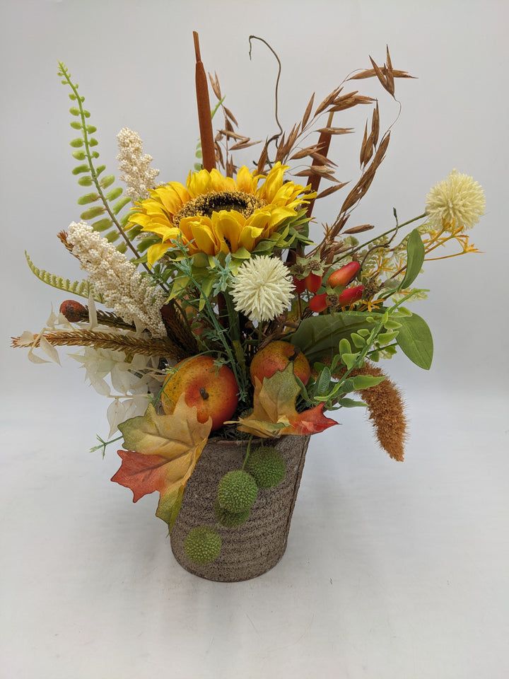 Herbstgesteck Sonnenblume Äpfel Gräser