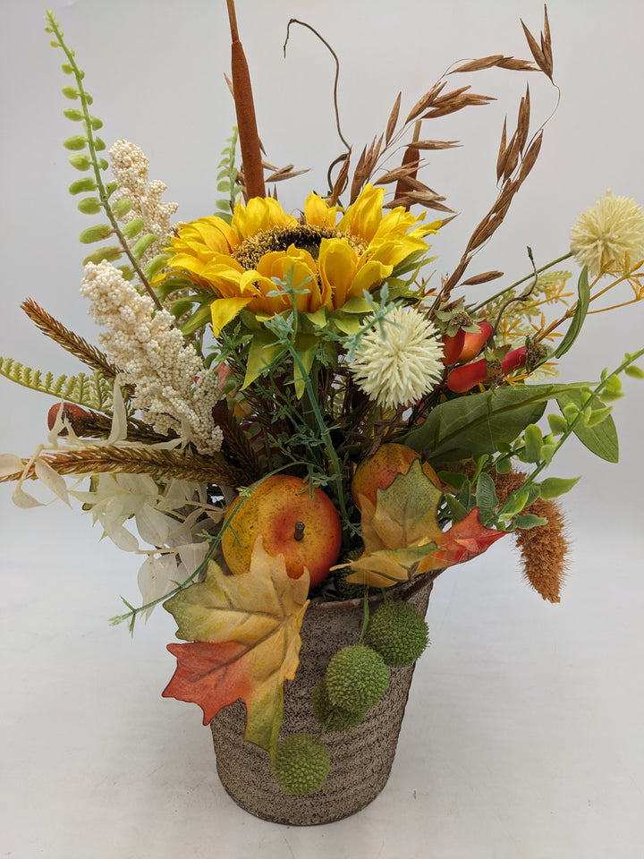 Herbstgesteck Sonnenblume Äpfel Gräser