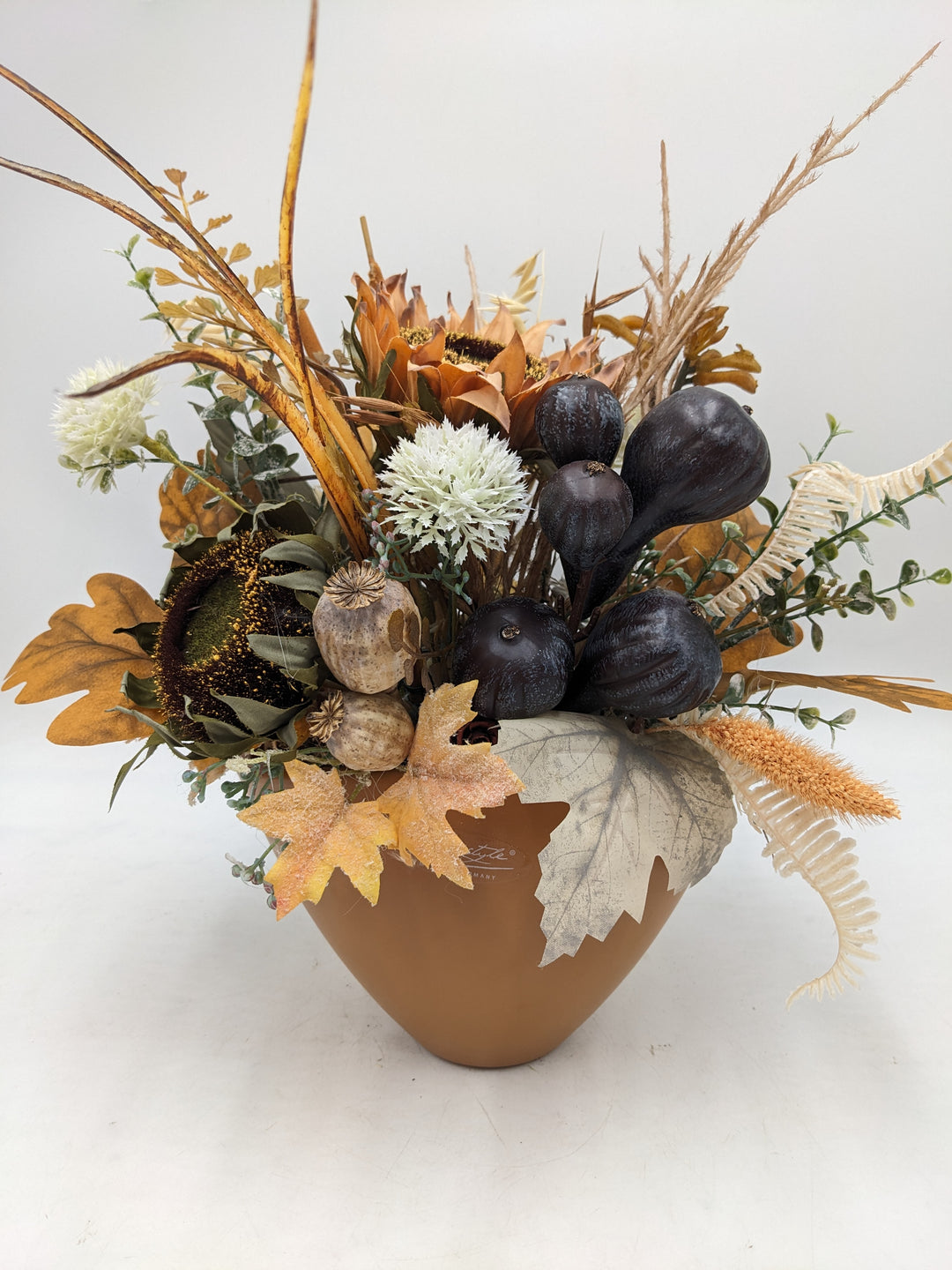 Herbstgesteck Sonnenblumen Feigen Gräser