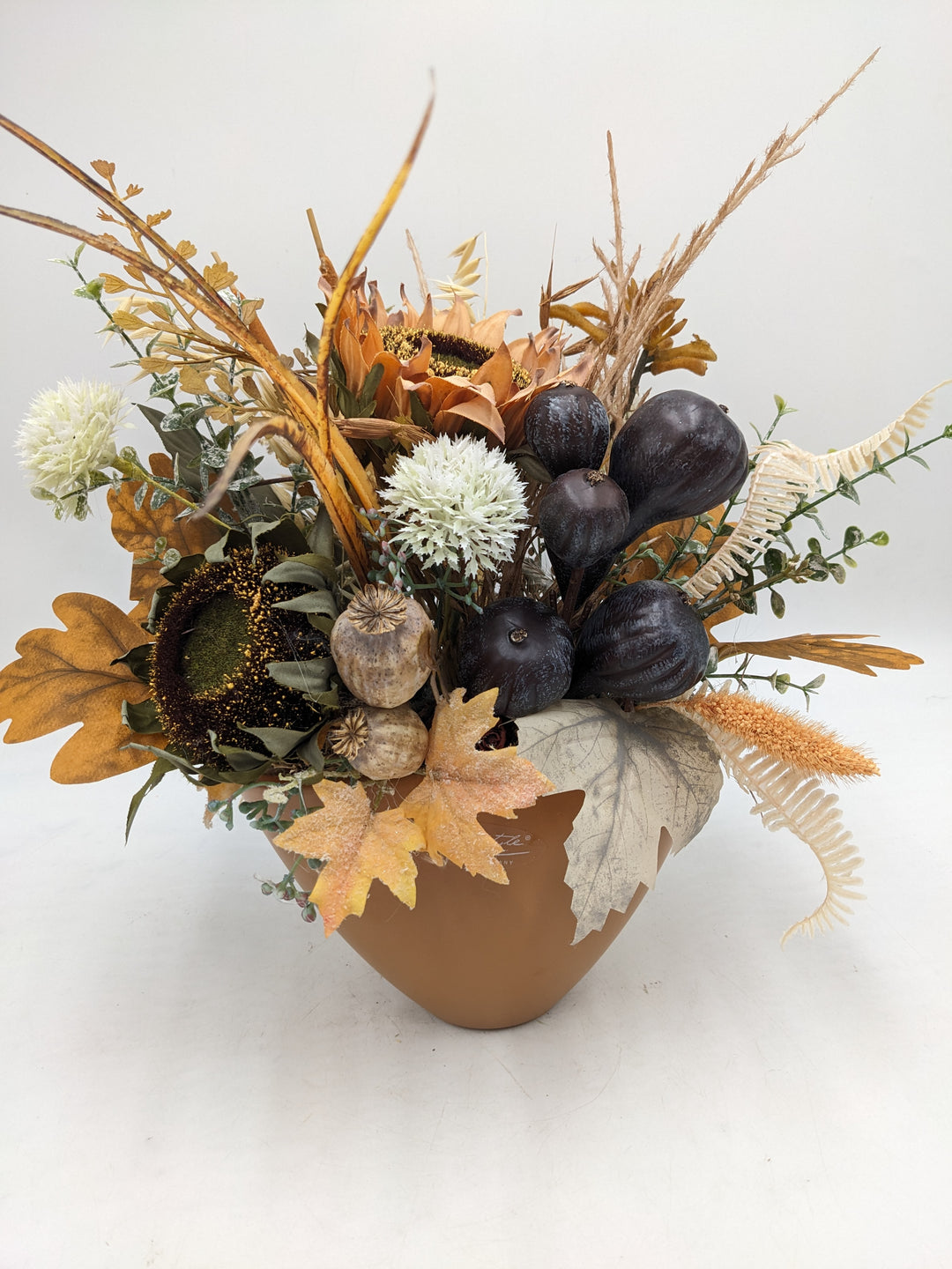 Herbstgesteck Sonnenblumen Feigen Gräser