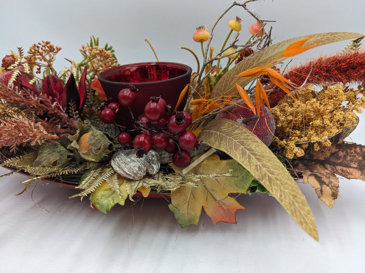 Herbstgesteck Teelicht Äpfel Beeren rot orange