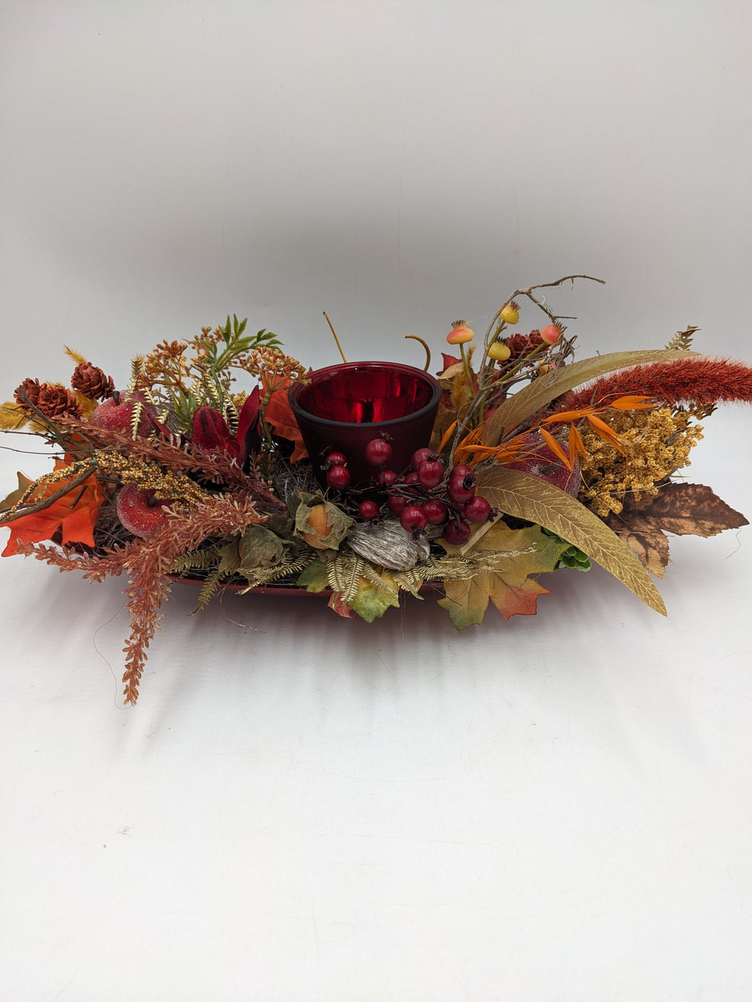 Herbstgesteck Teelicht Äpfel Beeren rot orange