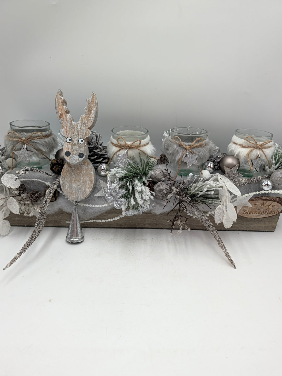 Weihnachtsgesteck Elch Teelichter Zapfen silber