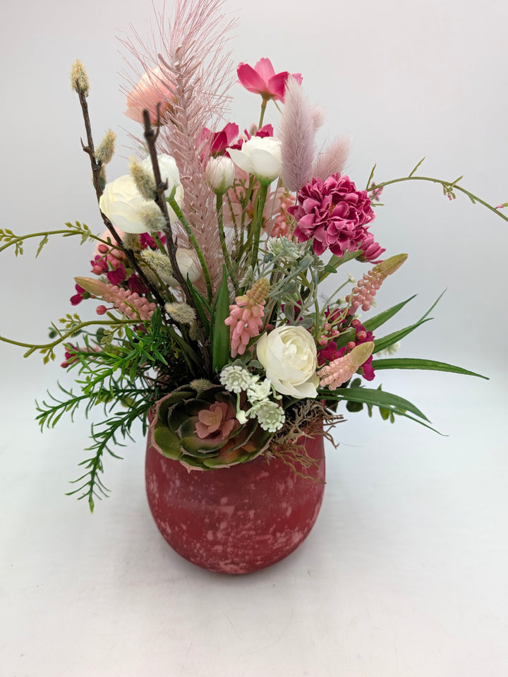 Frühlingsgesteck Hyazinthen Gräser rosa rot