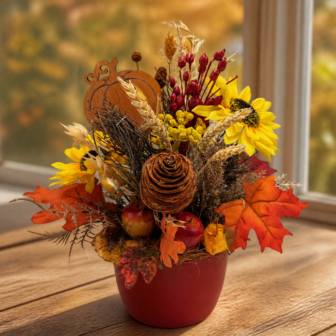 Szene Herbstgesteck Sonnenblume Apfel Zapfen Kürbis gelb orange