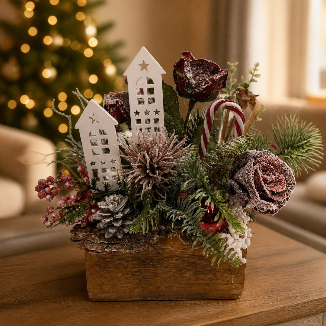 Szene Weihnachtsgesteck Rosen Zuckerstange Häuser rot weiß