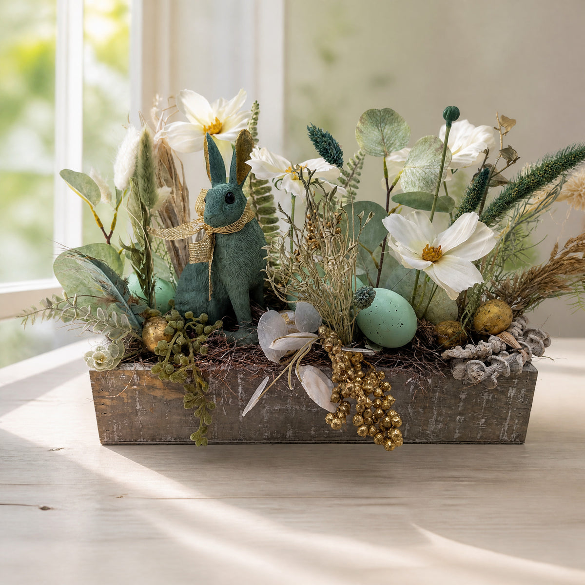 Szene Ostergesteck Hase Blüten Eukalyptus Eier grün weiß gold