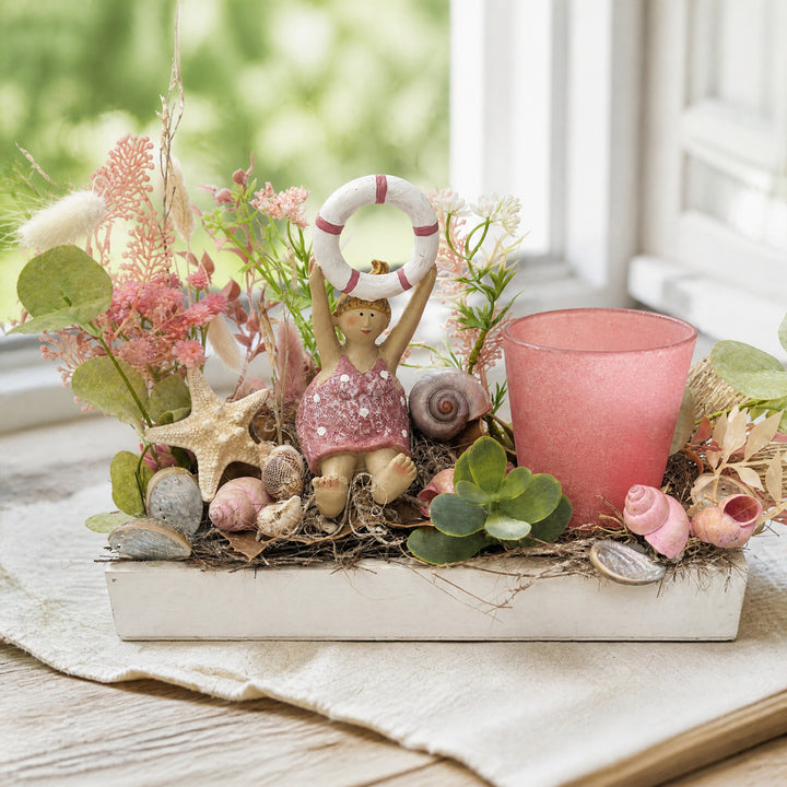 Szene Sommergesteck Schwimmerin Seestern Muscheln Teelicht rosa
