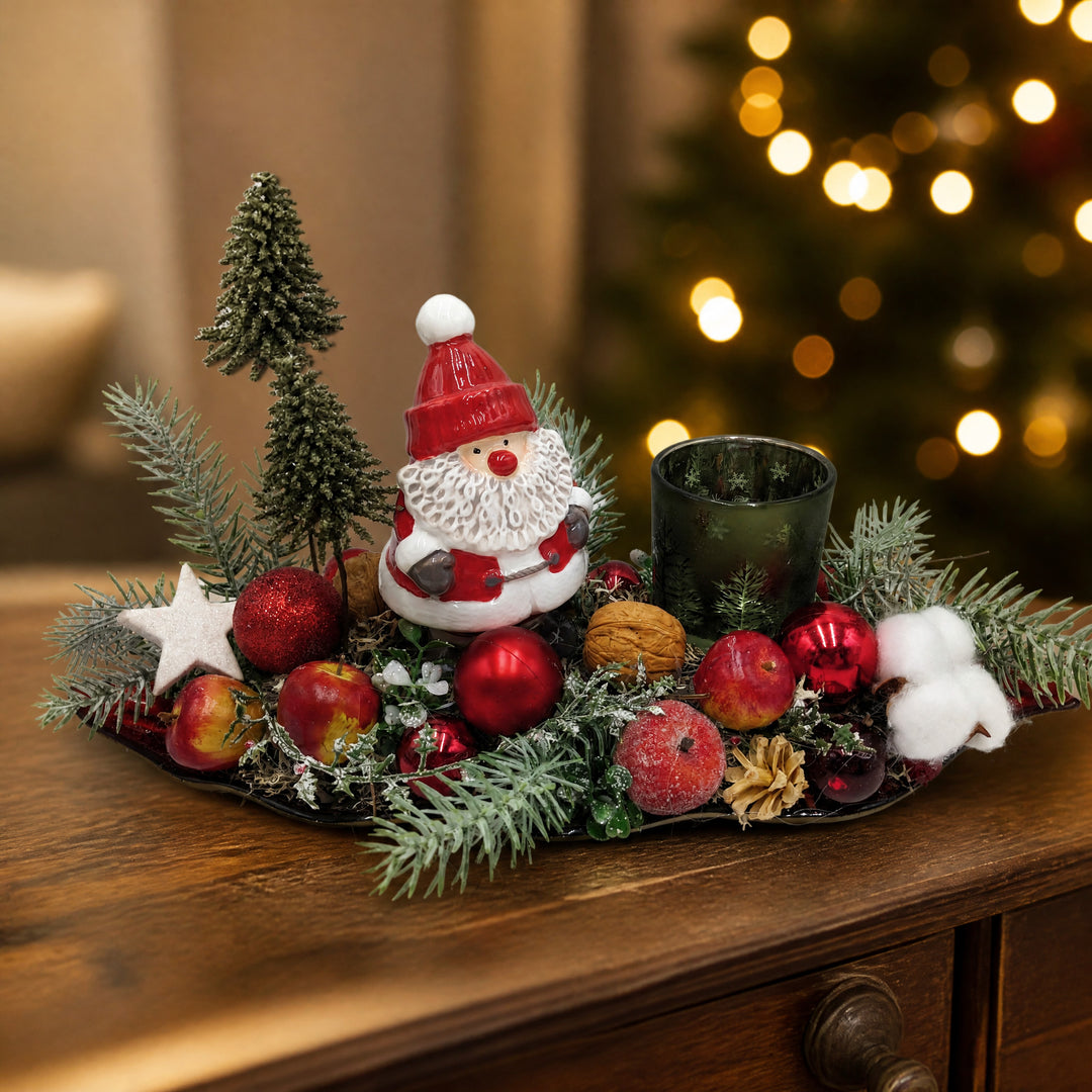 Szene Weihnachtsgesteck Weihnachtsmann Teelicht Äpfel Bäume rot grün