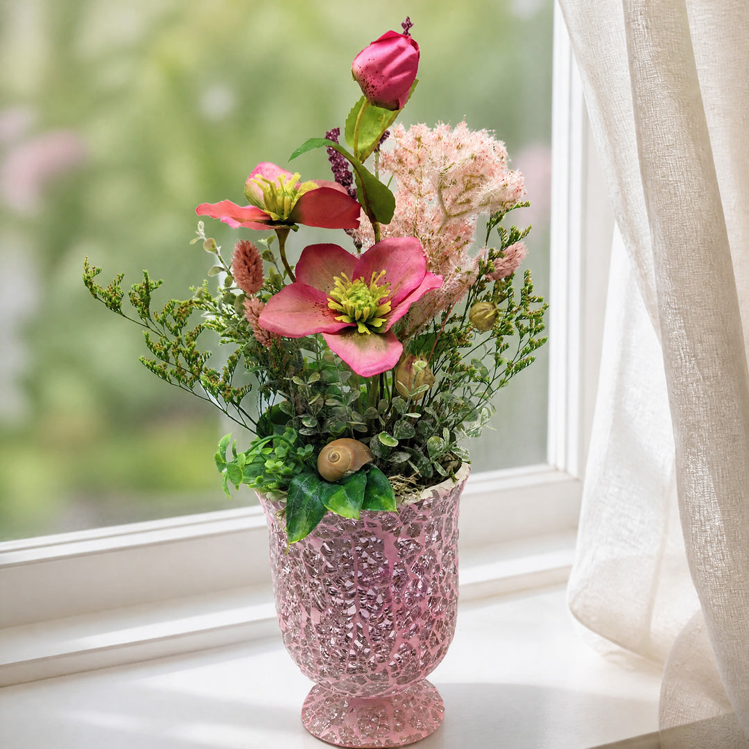 Szene Frühlingsgesteck Christrosen Gräser Schnecke Pokal rosa